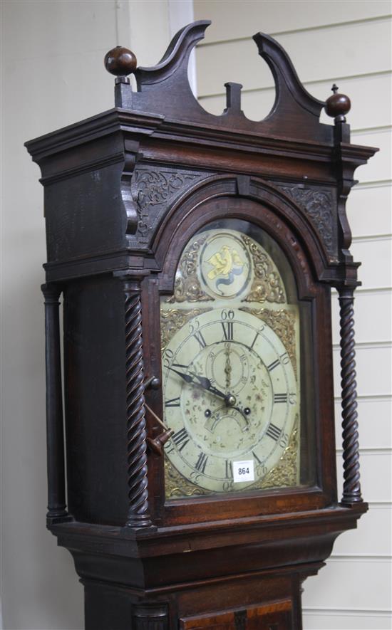 A late 18th century oak and mahogany eight day longcase clock, with painted arched and gilt brass dial